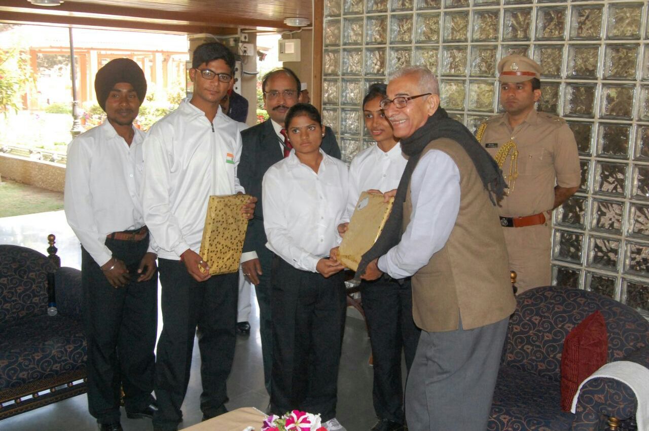Students Receiving Memento from H.E. The Governor of Gujarat following their Participation in State R-Day Parade, 2017